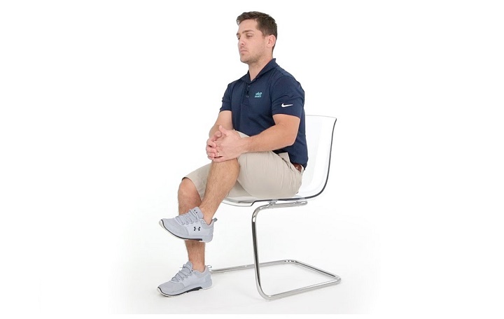 Exercise for sciatica pain - knee to chest movement in a seated position