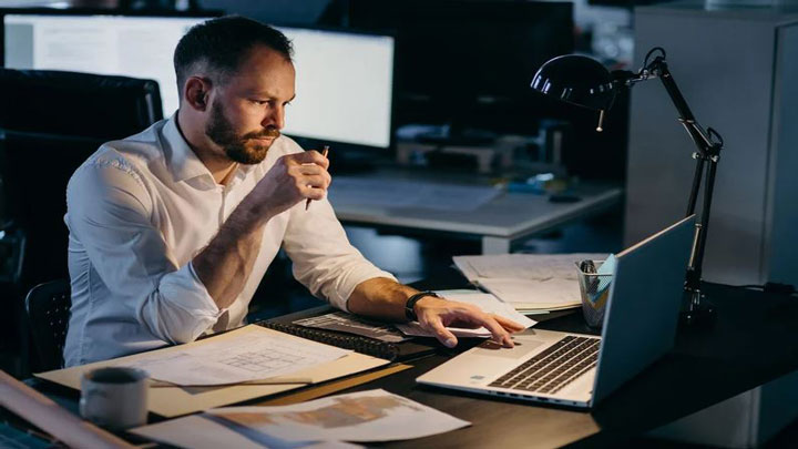 A person behind a desk