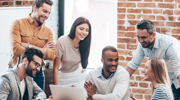 Employees interacting with each other in a healthy work environment